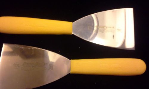 Two Yellow Dexter Russell Stiff Pan/Griddle/Grille Scrapers. SaniSafe # S293.