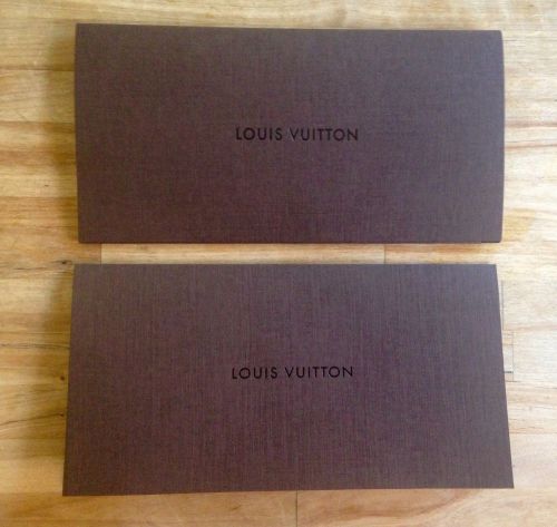 Two Louis Vuitton bill receipt envelopes