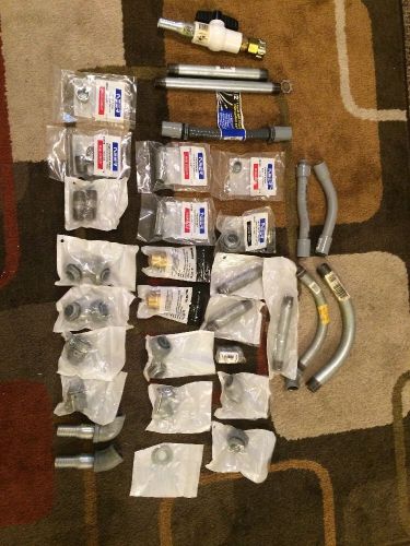 Lot of 32 mixed neer, watts, mueller etc. conduit nipples, pipes and parts for sale