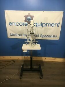 Burton 835 platinum series slit lamp w/ adjustable height stand.  nice condition