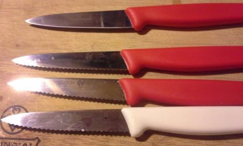 Four paring knives.  (3) have serrated blades. (1) is non-serrated.  icel brand for sale