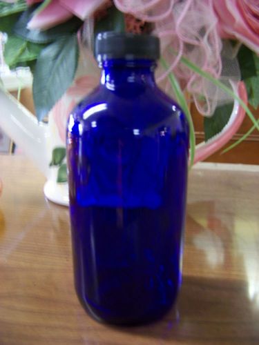 8 oz cobalt blue boston round glass bottle with phenolic lid cap for sale