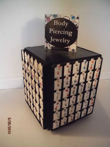 4-Sided Spinning Body Jewelry Display holds 144 pieces Comes w/Some Body Jewelry