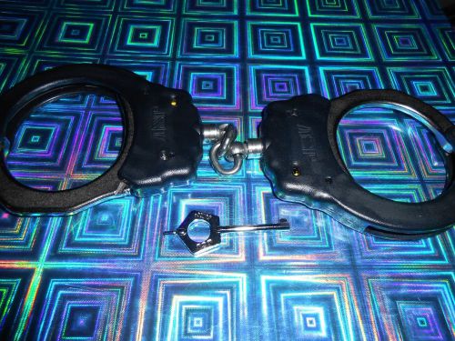 ASP IDENTIFIER HANDCUFFS. BLACK DESIGN WITH STEEL CHAIN. BRAND NEW NEVER USED