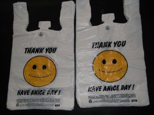 PLASTIC SHOPPING BAGS,T SHIRT TYPE GROCERY BAGS,HAPPY FACE WHITE 550 1/6 SIZE.