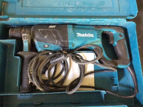 makita hr2641 hammer drill with new drill bit and new grinder