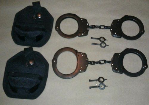 (2 SETS OF) BLACK PLATED DOUBLE LOCK POLICE HANDCUFFS W/ KEYS AND CASE