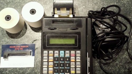 Credit card machine T7P..used in working condition..2 Xtra rolls and extra ink