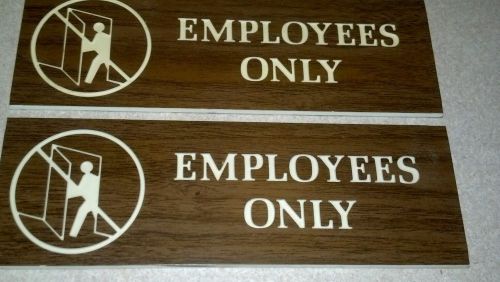 Older set of employees only signs