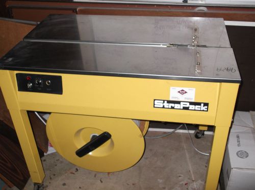 Strapack s680 semi automatic strapping machine w partial roll of strapping for sale