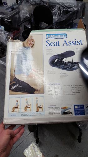 Seat assist by uplift, spring seat helper