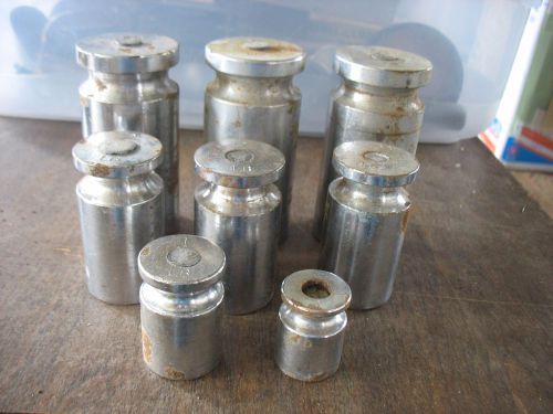 8 pc Used Carbon Steel lead filled Calibration Weights 22.8 lbs.