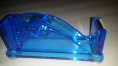 Tape Dispenser With 2 Pen Holders And 4 Suction Cups On The Bottom.