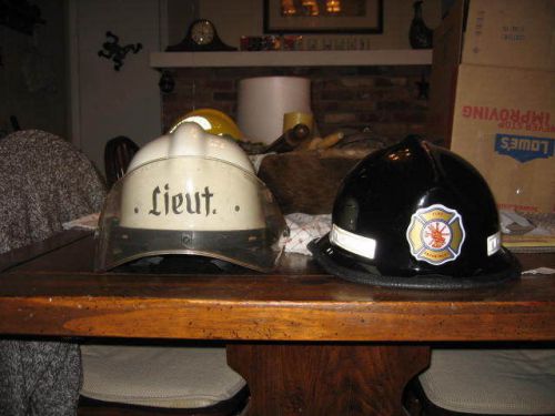 2 fire helmets..1 by american sports co. and a cairns 660