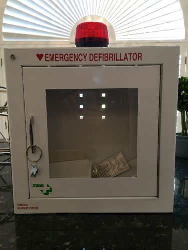 NEW AND UNUSED AED BASIC WALL STANDARD CABINET WITH ALARM AND STROBE