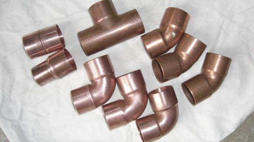 Lot of nine 1-1/4 copper fittings. 90 45 tee reducer and coupling