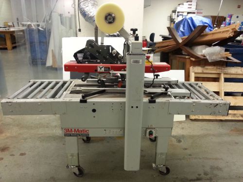 3M-Matic case sealing system with 6 ft. roller table