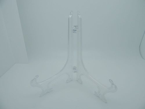 One new clear acrylic stand display for light product support