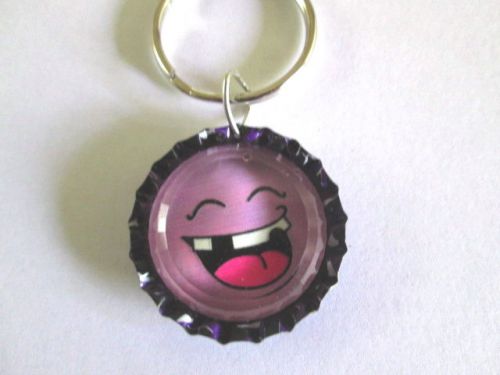 KEY RING OR ZIPPER PULL PURPLE FUNNY FACE PURSE. JACKET ,KEY CHAIN, BACK PACK