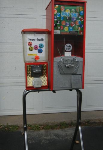 Gumball and toy / bouncy ball vending machines on a stand for sale