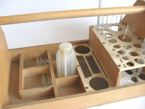 Vintage medical laboratory glassware in wooden box