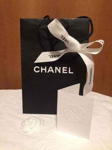 1 Chanel Empty Black Small Shopping Bag, 1 Chanel Camellia, 1 Chanel Ribbon- New