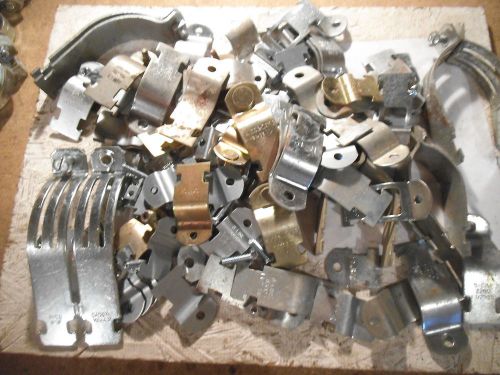 Large lot of mixed sized unistrut pipe/ conduit clamps - most new for sale