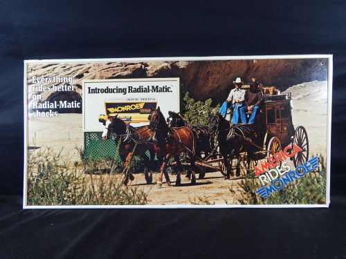 Vintage monroe &#034;everything rides better on radial-matic shocks&#034; metal tin sign for sale