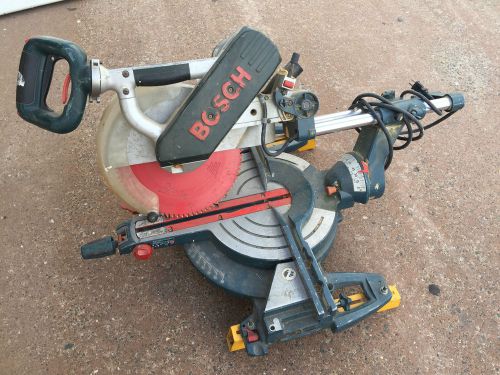 Bosch 4412 12-inch dual-bevel slide miter saw w/ blade &amp; table legs for sale