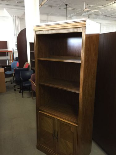 Wall unit/bookcase w/ storage by broyhill in med oak color for sale