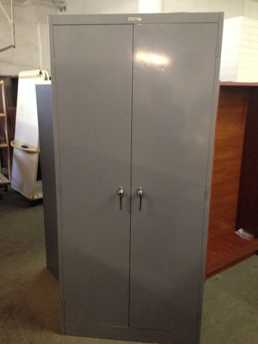 Metal storage cabinet w/ 5 shelves w/lock &amp; key for sale