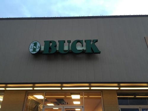 sign &#034;ONE BUCK&#034;