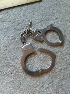 Nickel Plated Hand Cuffs With One Key Not Intended To Be in Child&#039;s Toy