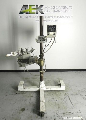 Used- Accraply Model IM-4000 Pressure Sensitive Bottom Labeler. Mounted with hot