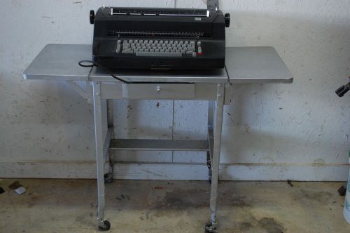 Vintage black typewriter IBM Selectric II (needs work) w/dust cover; metal table