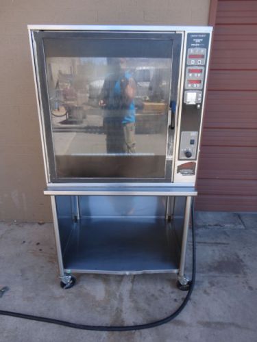 2011 HENNY PENNY SCR-8 WORKING ELECTRIC ROTISSERI OVEN WITH BASKETS AND STAND.