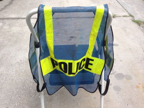 Used blue police safety vest with reflective yellow stripes for sale