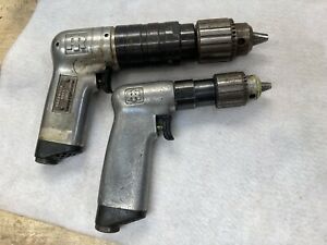 two Ingersoll pneumatic drills, 1/4 inch and 3/8 inch.