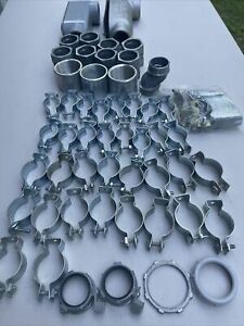 lot of 65 assorted 2”, 1-1/2”, 1-1/4” fittings. LB condulet, hanger strap, unist