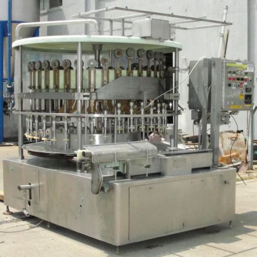 U.S Bottlers Machinery Company Model GE36LS liquid vacuum filler.