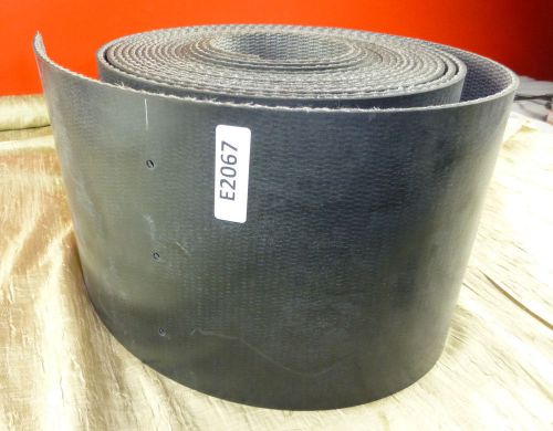 Black rubber conveyor belt 10&#034; x .21&#034; thick reinforced by the foot punched holes for sale