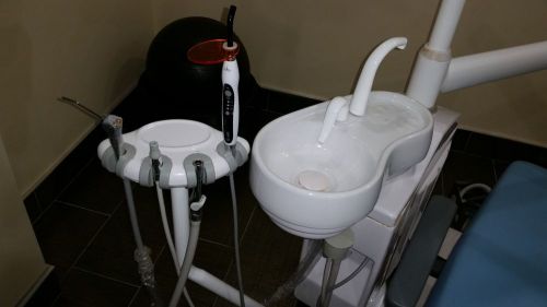 Sky blue dental chair with built in curing light and Piezoelectric unit