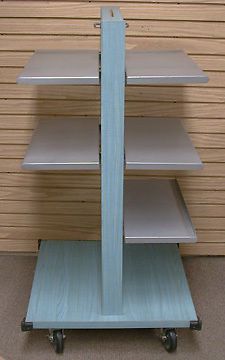 Two-sided turquoise maple slatwall display on wheels w/ adjustable metal shelves for sale