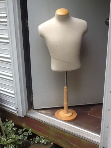 A clothing form maniquin with stand