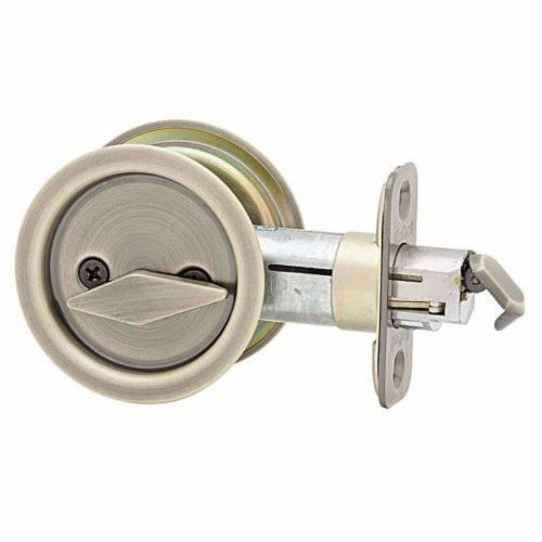 Kwikset 335-5 Antique Brass Round Privacy Pocket Door Lock