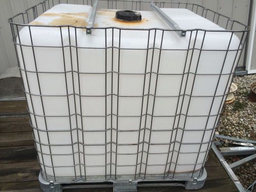 Plastic tote. apx 300 gal storage with valve for sale