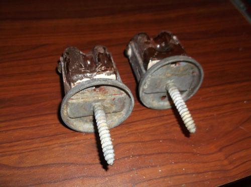 two ceramic screw in insulators