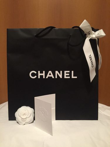 1 Chanel Empty Black Shopping Bag, 1 Chanel Camellia, 1 Chanel Ribbon - New