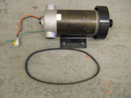 220v AC MOTOR ON BASE PLATE. APPROX 20 cms LONG x 8 CMS DIA WITH DRIVE BELT.