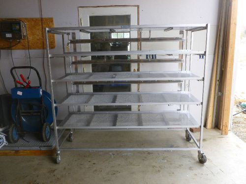 Heavy duty stainless steel rack with 6 shelf’s on swivel casters